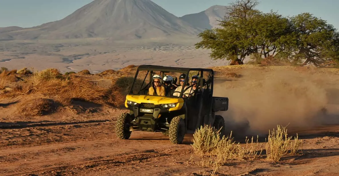 Off-road buggy kicking up dust in the dunes on an Atacama Desert buggy tour near San Pedro de Atacama, Chile