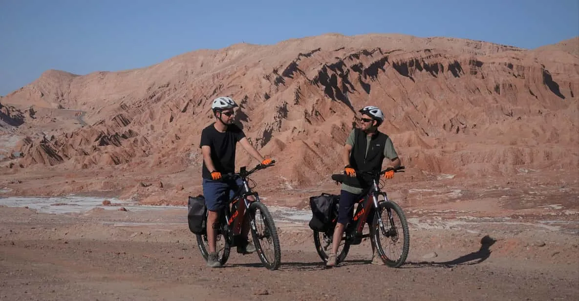 Cyclist on an e-bike crossing the Salt Mountain Range on a Moon Valley Atacama Desert e-bike tour in Chile
